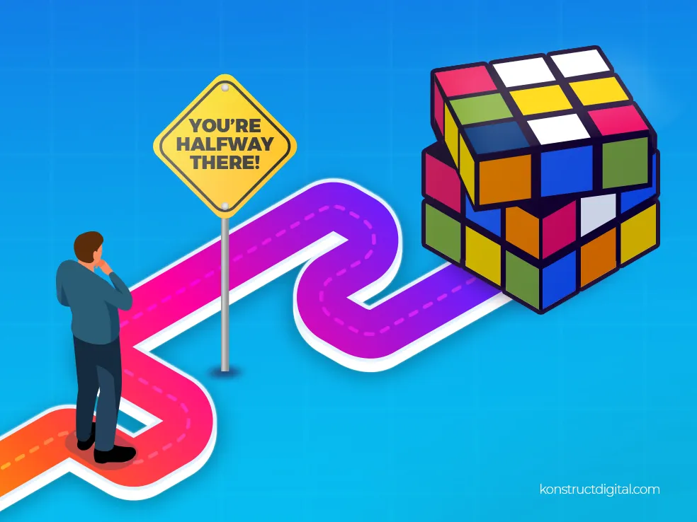 A man on a path to a rubik's cube with a sign that says, "you're halfway there!" 