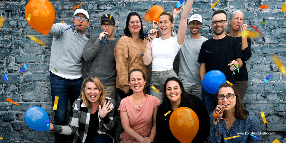 A banner image with the Konstruct team celebrating.