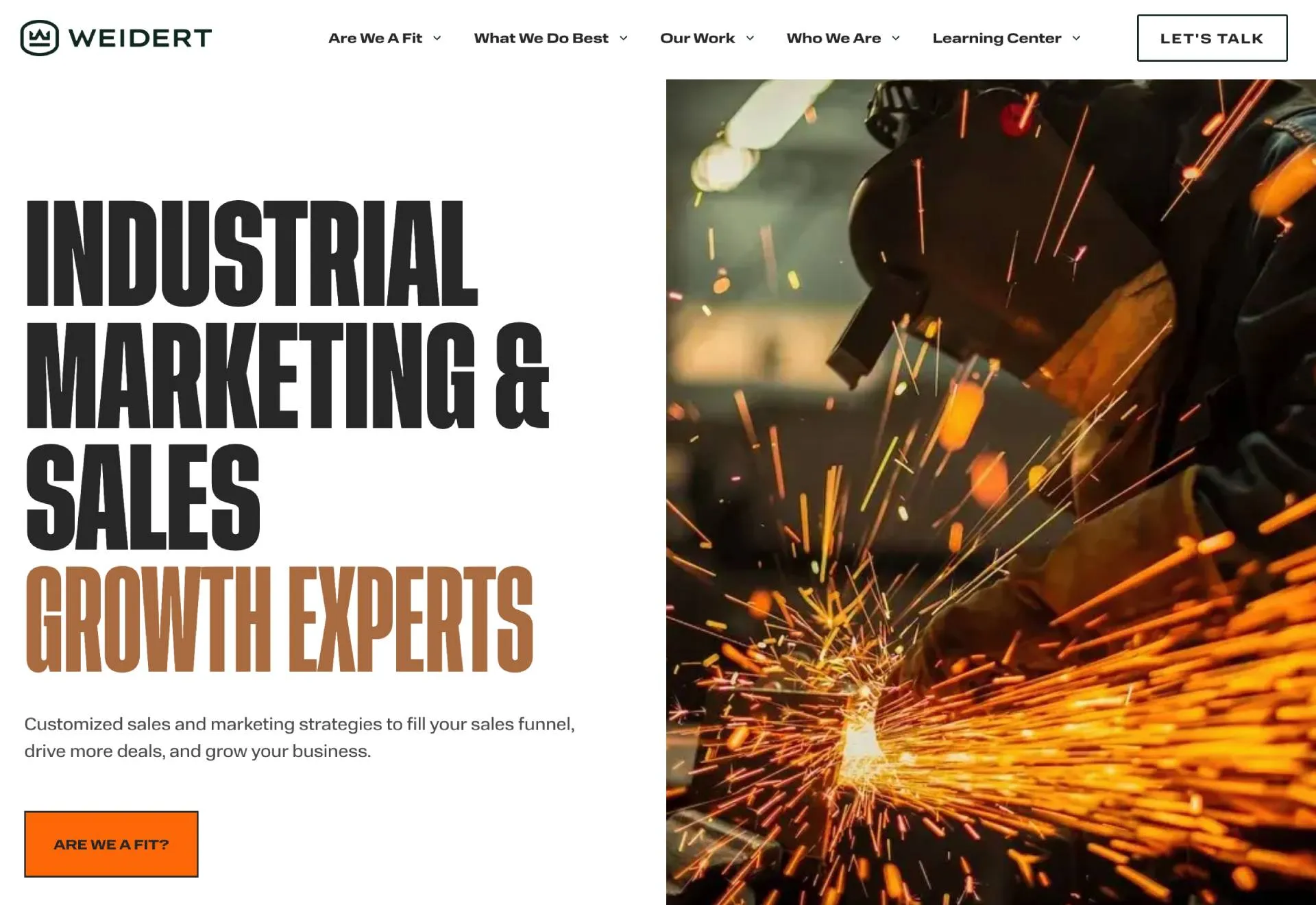 Homepage of an industrial marketing agency featuring bold text “Industrial Marketing & Sales Growth Experts” alongside an image of a worker welding with bright sparks flying.