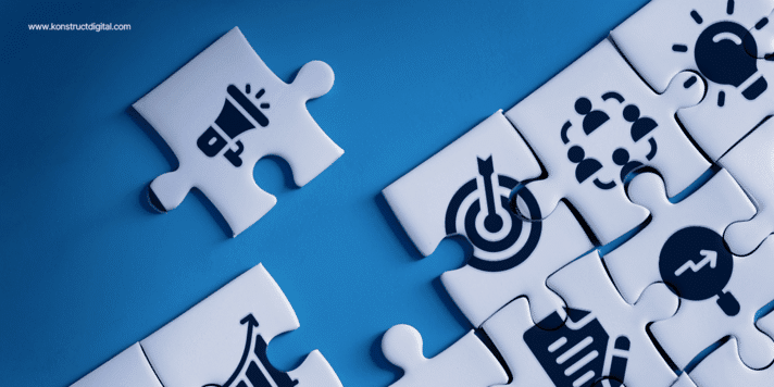 Puzzle pieces featuring digital marketing icons such as a megaphone, target, lightbulb, and growth chart, symbolizing the interconnected elements of a successful B2B marketing strategy.