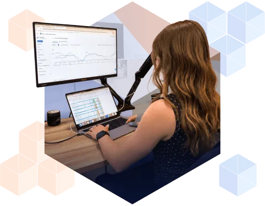 A person manages LinkedIn ad campaigns and reviews performance data across a target account list.