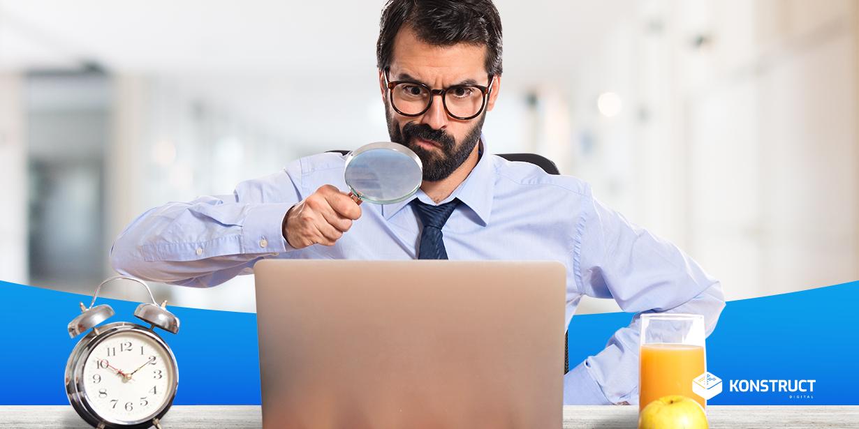 man looking at computer with a microscope