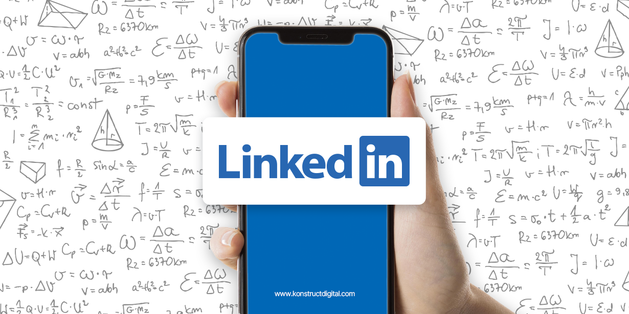 A hand holding a smartphone with LinkedIn on the screen surrounded by math equations