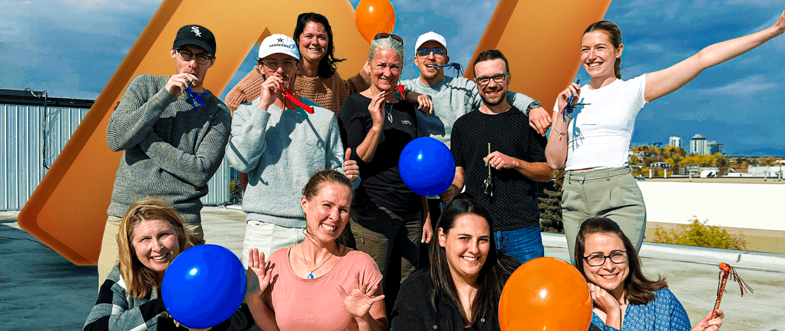 The Konstruct Digital team celebrating with balloons and party blowers